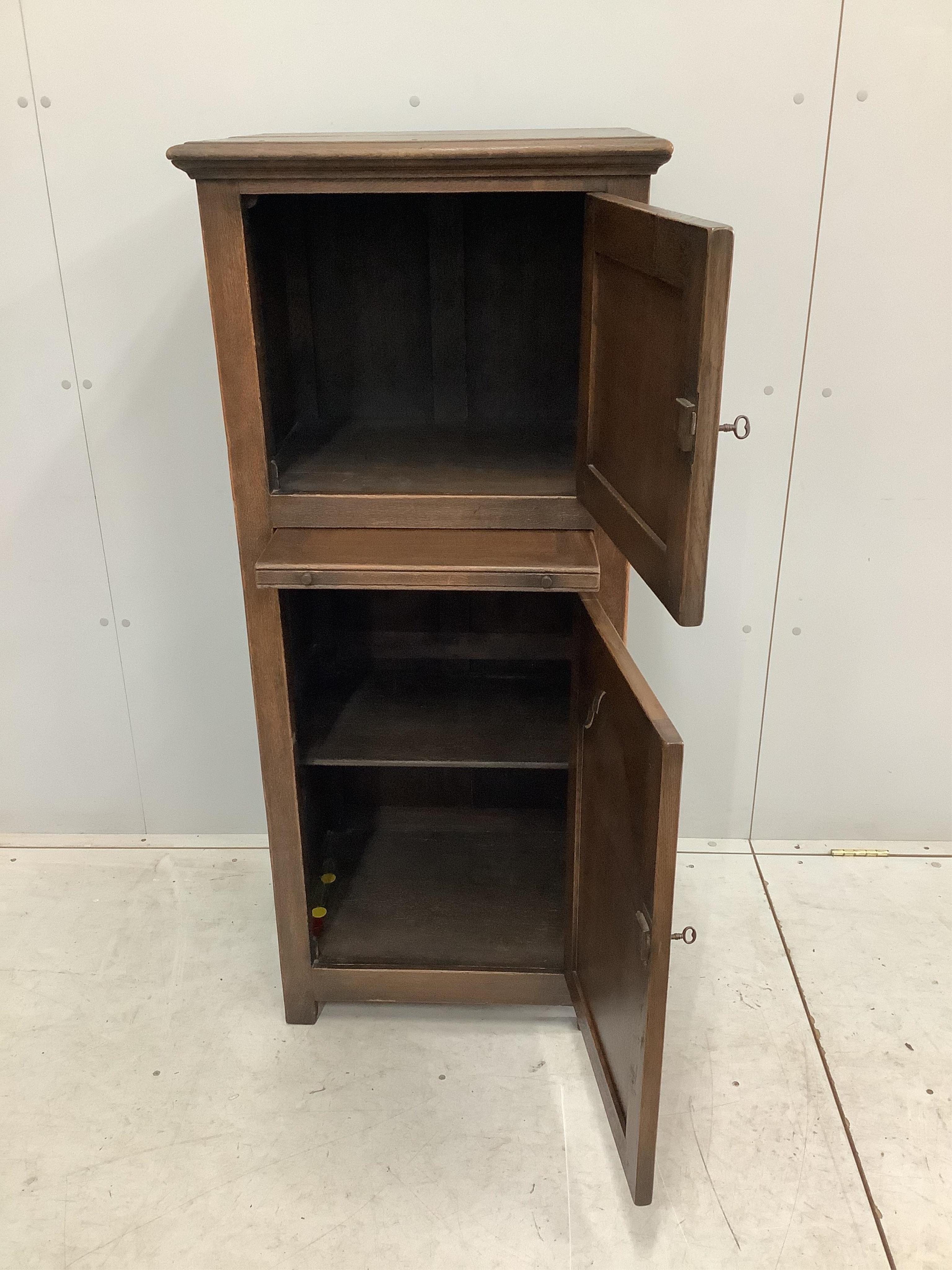 A 17th century style Ipswich oak cabinet, width 56cm, depth 42cm, height 129cm. Condition - fair to good